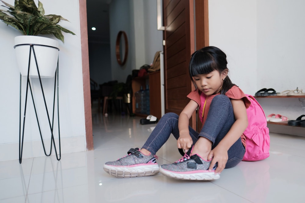 OT - girl putting on shoes