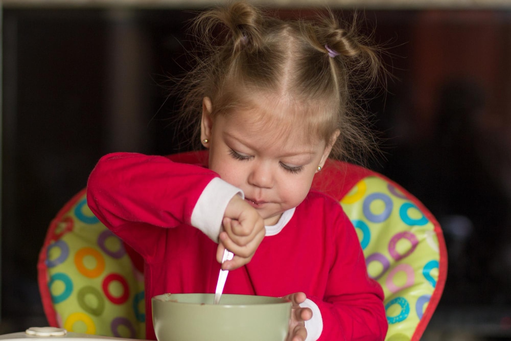 OT girl feeding herself