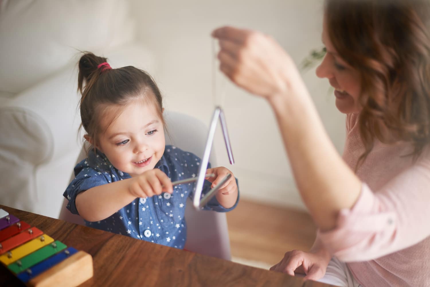 mother-daughter-playing-triangle