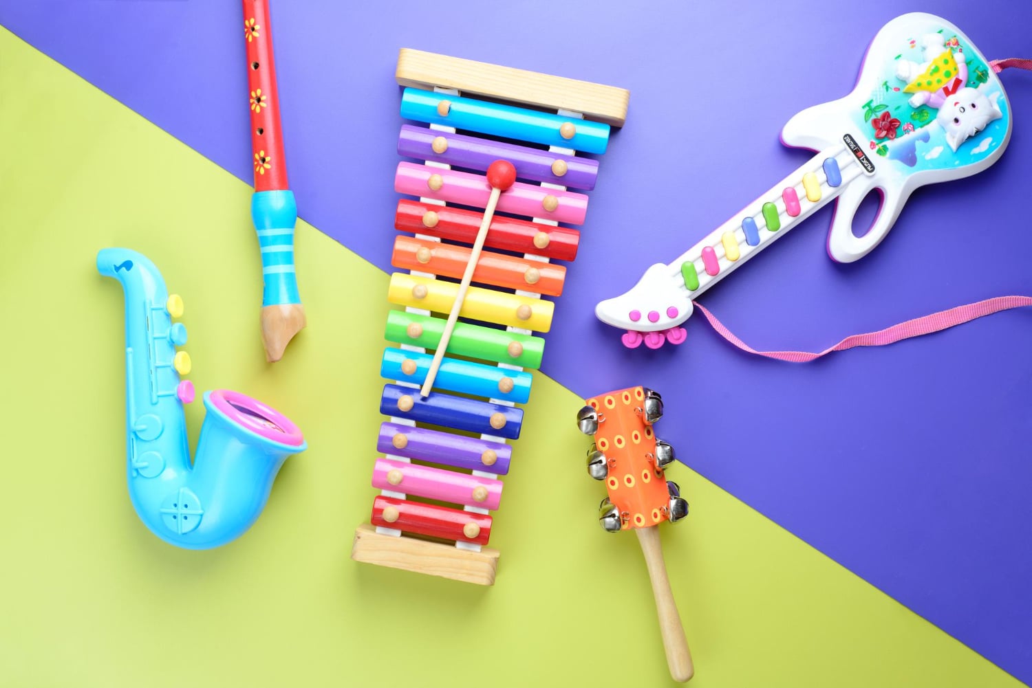 toy-musical-instruments-wooden-background